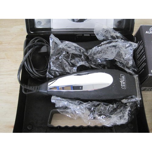 205 - A new hair cutting set along with other various electrical and a mechanical corkscrew