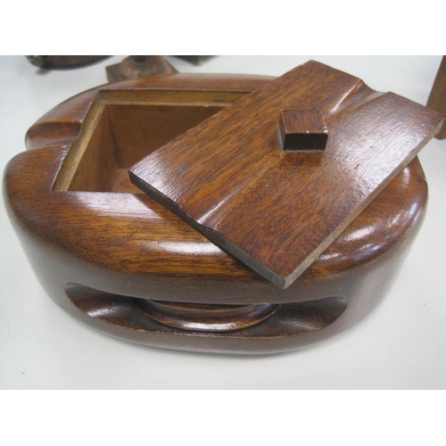 212 - Wooden tobacco jar shaped as barrel Reg. Design No 781624, a mahogany tobacco box shaped as a pulley... 