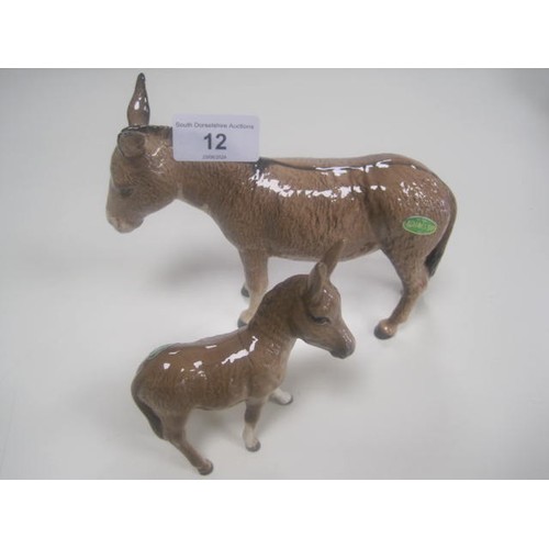 12 - Beswick donkey (height 13.5cm) and a Beswick donkey foal (height 10.5cm). Both very good condition a... 