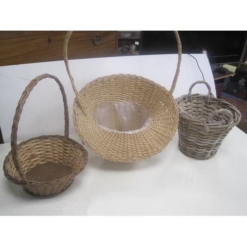 18 - A wicker waste paper basket, and two wicker flower-arranging type baskets