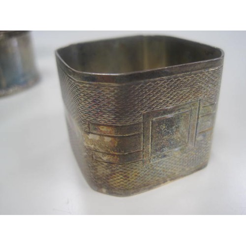 186 - A silver art deco style napkin ring along with a silver bracelet.
Three more napkin rings and two sm... 