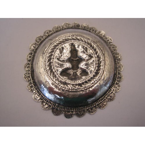 241 - Small Indian round tray with petal rim, the centre embossed with seated figure, diameter 8cm, 33.1g.... 