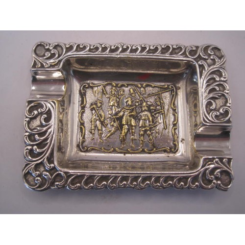 247 - Silver-plated ashtray, oblong, embossed to the centre with a scene of cavaliers with staff and muske... 