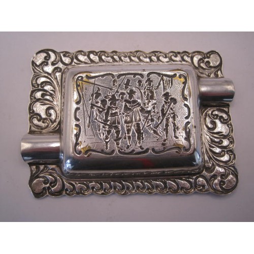 247 - Silver-plated ashtray, oblong, embossed to the centre with a scene of cavaliers with staff and muske... 