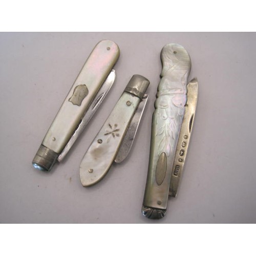 251 - Three silver and mother of pearl fruit knives - (1) handle carved to one side as a horn of plenty, b... 