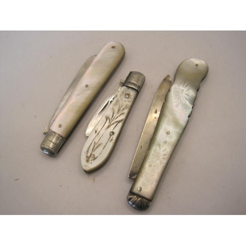 251 - Three silver and mother of pearl fruit knives - (1) handle carved to one side as a horn of plenty, b... 