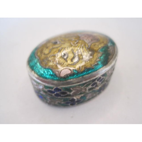 257 - 925 silver and enamel pill with lid decorated as a tiger's head in yellow, pink and black. Oval, rem... 