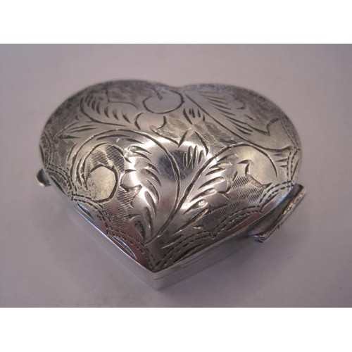 258 - 925 imported silver heart-shape pill box, cushion hinged lid engraved with foliage, stamped 925 with... 