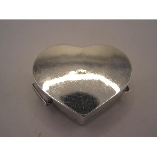 258 - 925 imported silver heart-shape pill box, cushion hinged lid engraved with foliage, stamped 925 with... 