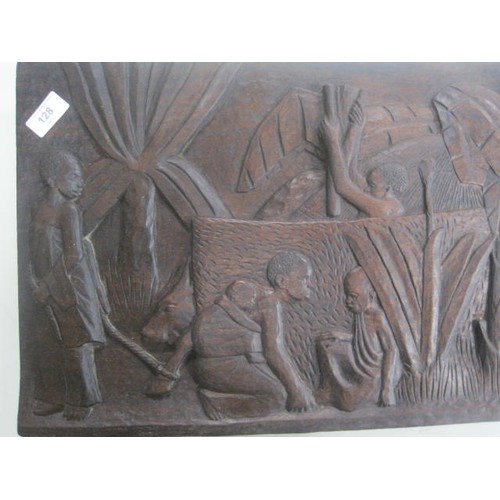 128 - An African hardwood relief carving of people, animals and trees by Munorgo Gehard, in good order