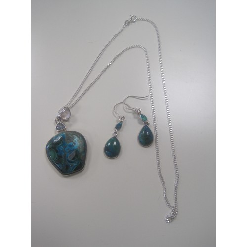 38 - A 925 silver squared oval pendant set with a marbled green and turquoise colour stone, the mount wit... 