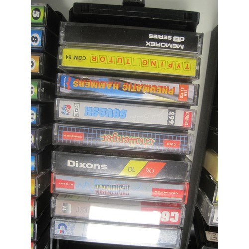 98 - A Commodore 64 cassette drive in box, plus a quantity of Commodore 64 software on cassette tapes, pl... 