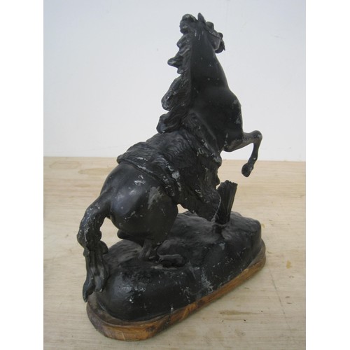 34 - Metal horse on wooden base