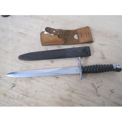 52 - A modern Swedish army bayonet in scabbard with leather frog attached, some wear to base of scabbard ... 