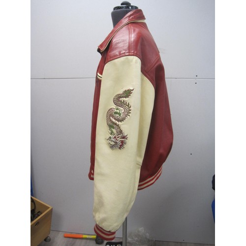 82 - Red and cream leather jacket, embroidered to the back and sleeves with dragons, size XL, labelled To... 