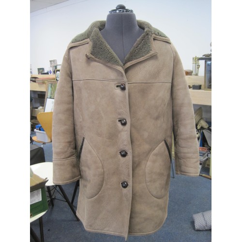 111 - (1) Gents beige sheepskin coat with brown leather buttons (a/f some stains to front and left sleeve)... 