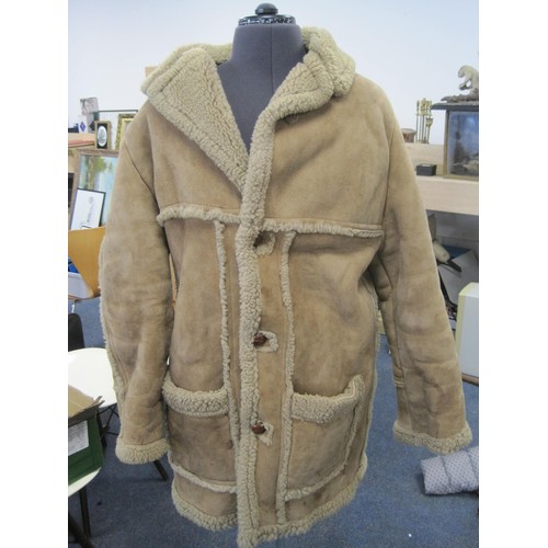 111 - (1) Gents beige sheepskin coat with brown leather buttons (a/f some stains to front and left sleeve)... 