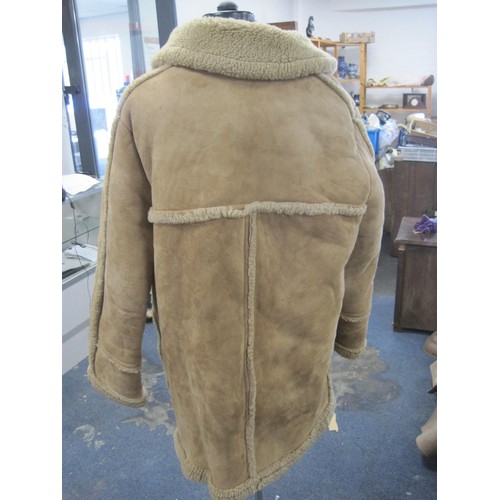 111 - (1) Gents beige sheepskin coat with brown leather buttons (a/f some stains to front and left sleeve)... 