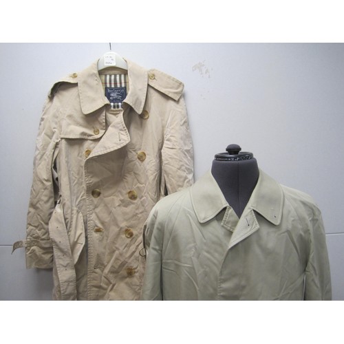 84 - Burberrys rain coat and Burberrys trench coat. The single-breasted rain coat is labelled 48 REG HM17... 