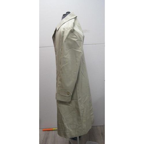 84 - Burberrys rain coat and Burberrys trench coat. The single-breasted rain coat is labelled 48 REG HM17... 