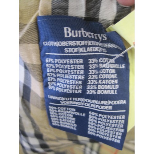 84 - Burberrys rain coat and Burberrys trench coat. The single-breasted rain coat is labelled 48 REG HM17... 