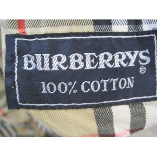 84 - Burberrys rain coat and Burberrys trench coat. The single-breasted rain coat is labelled 48 REG HM17... 