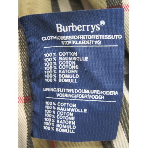 84 - Burberrys rain coat and Burberrys trench coat. The single-breasted rain coat is labelled 48 REG HM17... 