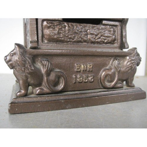 73 - Cast metal money box modelled as The Coronation Chair, height 21cm, marked E II R 1953, HARPER REG D... 