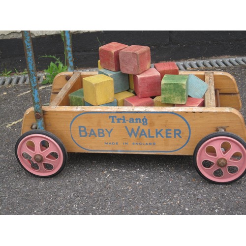 78 - Tri-ang Baby Walker with a bag of painted wooden bricks in various colours. Signs of age.