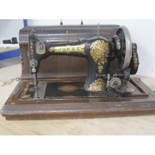 91 - A Jones hand turn mechanical sewing machine with carry case  and original key