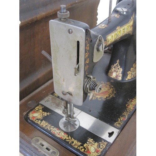 91 - A Jones hand turn mechanical sewing machine with carry case  and original key