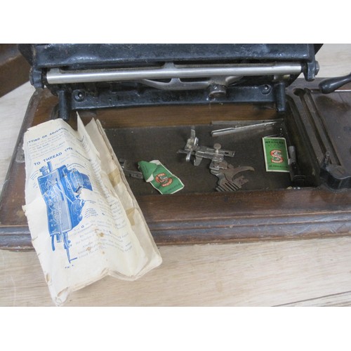 91 - A Jones hand turn mechanical sewing machine with carry case  and original key