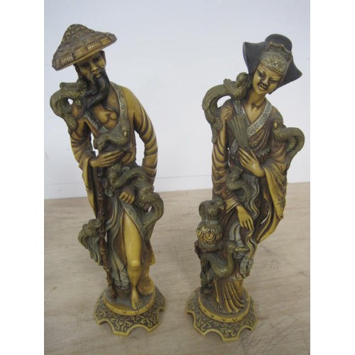 217 - A pair of resin Oriental-style figures, a vintage Black Watch decanter and a Toby jug