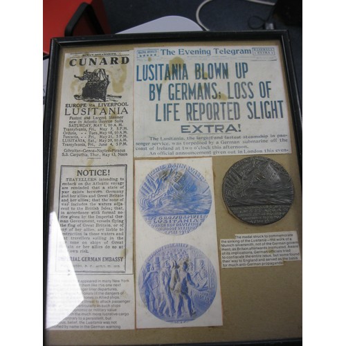 203 - A framed and glazed German Lusitania medal, possibly repro, and a number of facsimile newspaper head... 