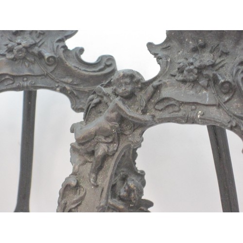 154 - A pair of bronze cherub photo frames