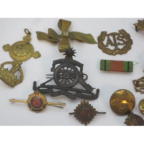 161 - A selection of military badges and other items including cross belt whistle and a bosun's whistle