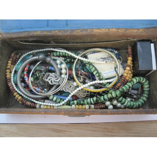 151 - A leather jewellery box and contents