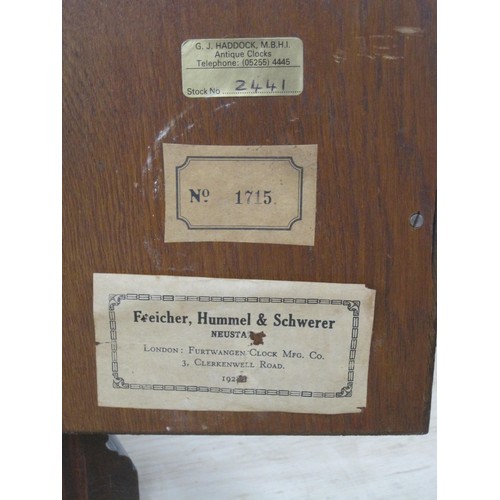 162 - An oak cased mantle clock