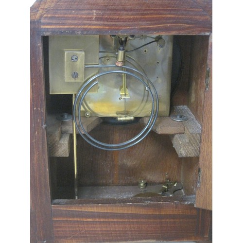 162 - An oak cased mantle clock