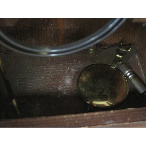 162 - An oak cased mantle clock