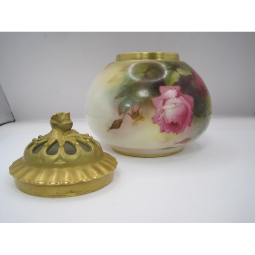 174 - A Royal Worcester rose decorated pot-pourri jar and cover