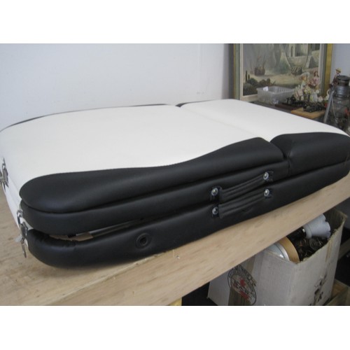 244 - A portable massage table in carry case, in good condition