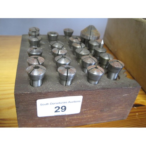 29 - Another wooden holder of threaded collets along with a centre holder