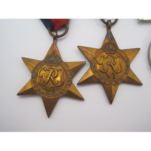 77 - A group of four World War 2 medals and ribbons (Defence Medal, 1939-1945 War Medal, The 1939-1945 St... 