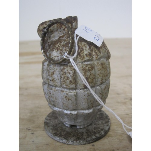 183 - An inert Mills bomb hand grenade mase into a paperweight, stamped with the letter 'K' and mounted on... 