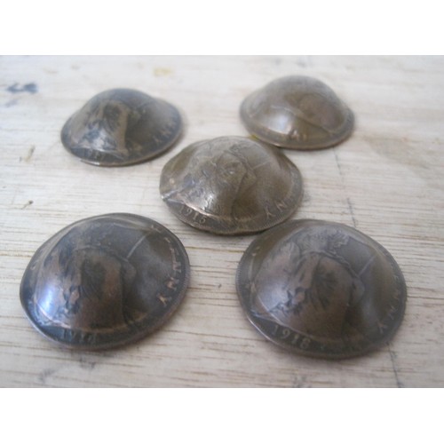 186 - A set of five British army Brodie helmets made from English copper pennies, each coin dated for a ye... 