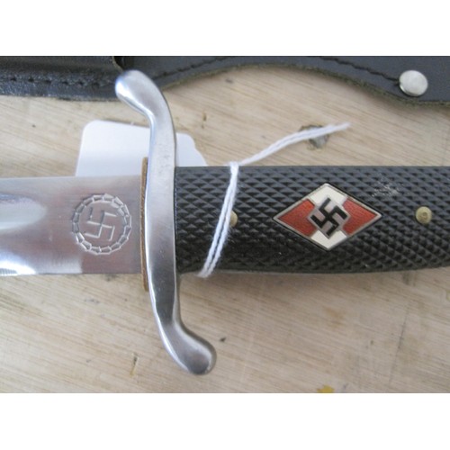 188 - A WWII-style repro Hitler Youth side arm in its metal scabbard and frog. Blade length of 25cm