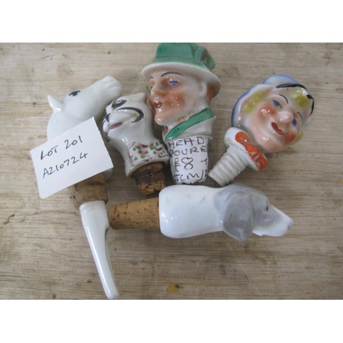 201 - A white porcelain horse's head bottle stopper pourer, and four other ceramic bottle stoppers - dog, ... 