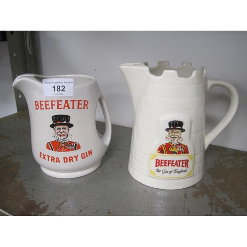 182 - Three gin advertising water jugs - (1) A James & Co Goldprint Squires London Dry Gin. (2) Beefeeater... 