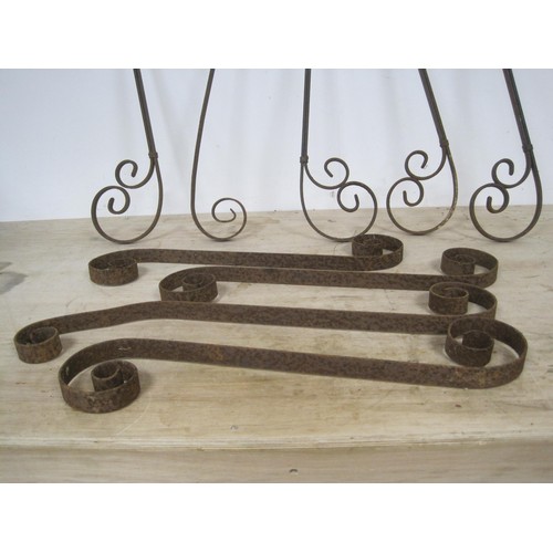 52 - Nine ornate wrought iron decorative wall brackets and springs (66cm long)